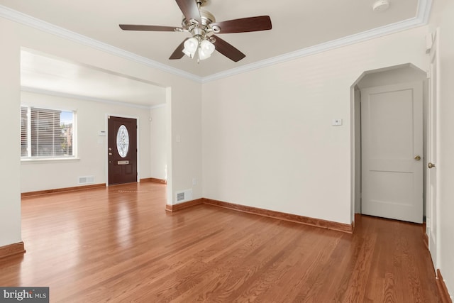 entryway featuring light hardwood / wood-style flooring, ceiling fan, and ornamental molding