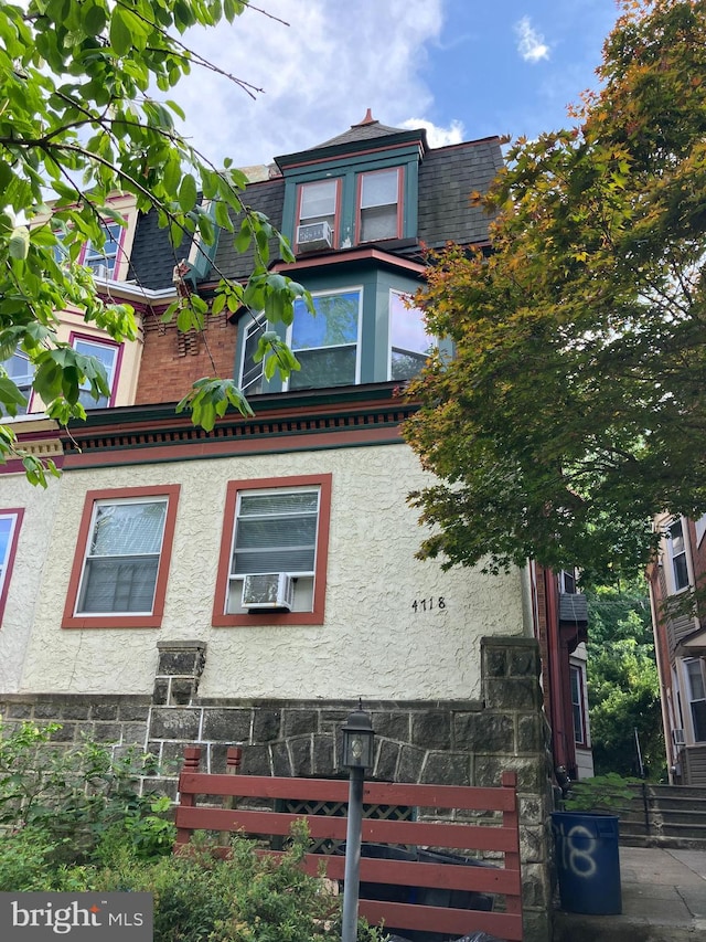 view of front of property featuring cooling unit