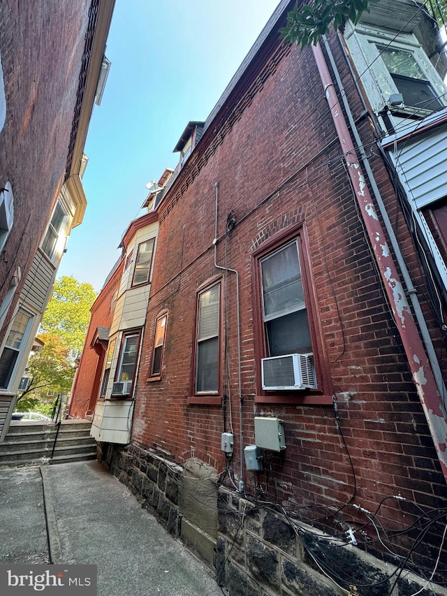 view of side of home with cooling unit