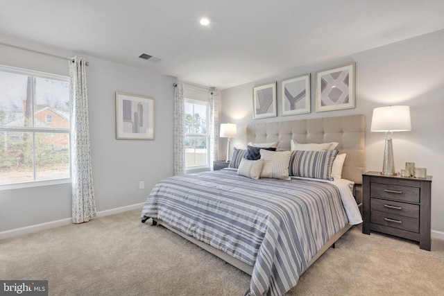 bedroom featuring light carpet