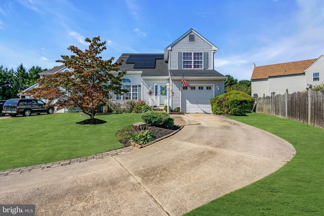 view of property with solar panels and a front yard