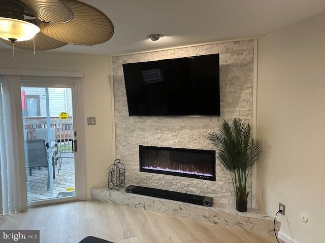 unfurnished living room with wood-type flooring and a fireplace