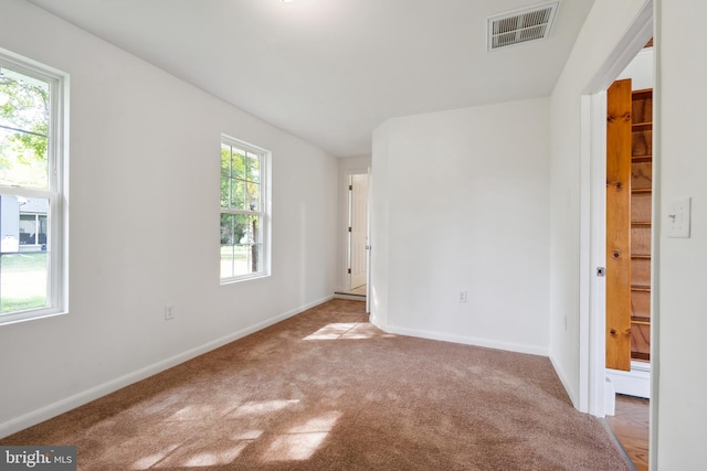 unfurnished room with carpet floors