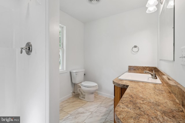 bathroom with vanity and toilet