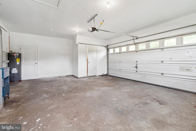 garage with a garage door opener and electric water heater