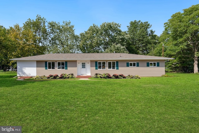 ranch-style home with a front yard