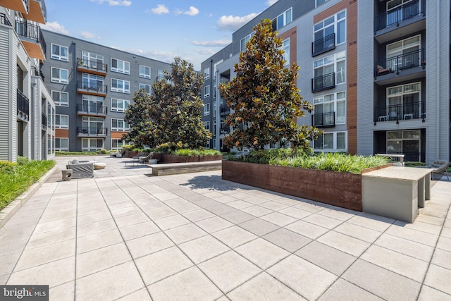 view of property's community with a patio area