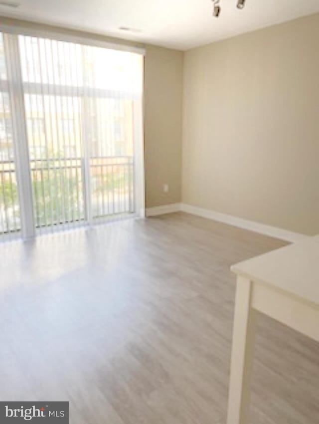 empty room featuring hardwood / wood-style floors