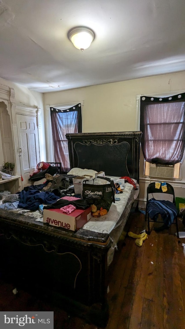 bedroom with hardwood / wood-style floors