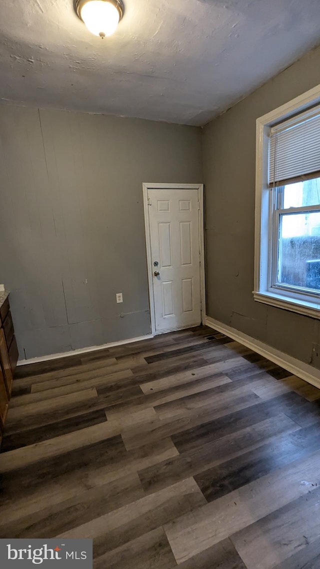 interior space with dark wood-type flooring