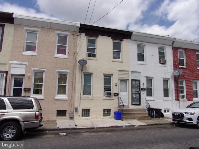 view of front facade with cooling unit