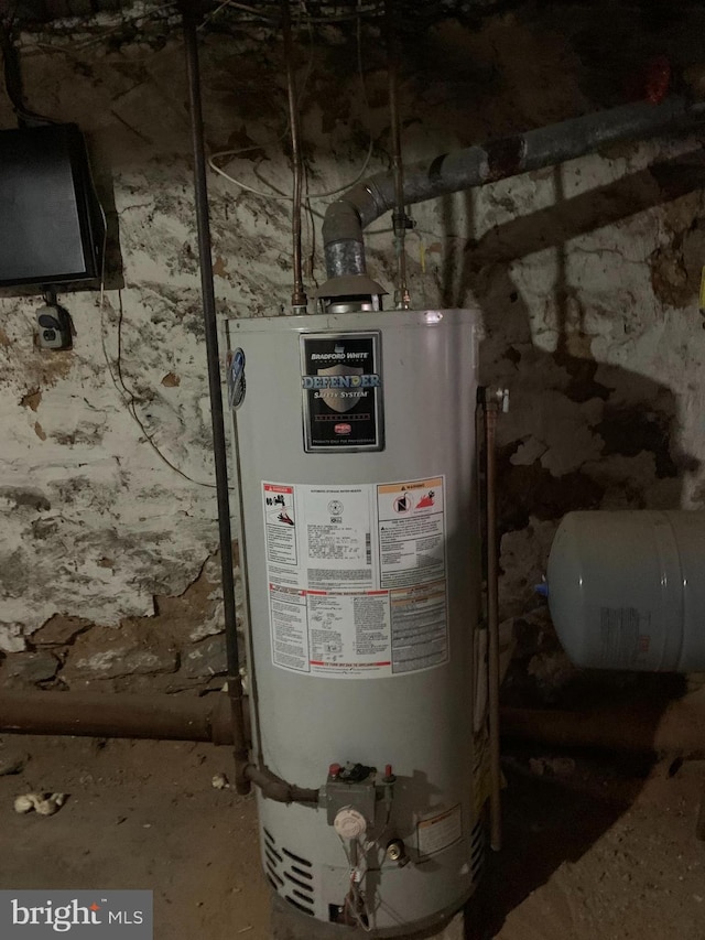 utility room featuring gas water heater