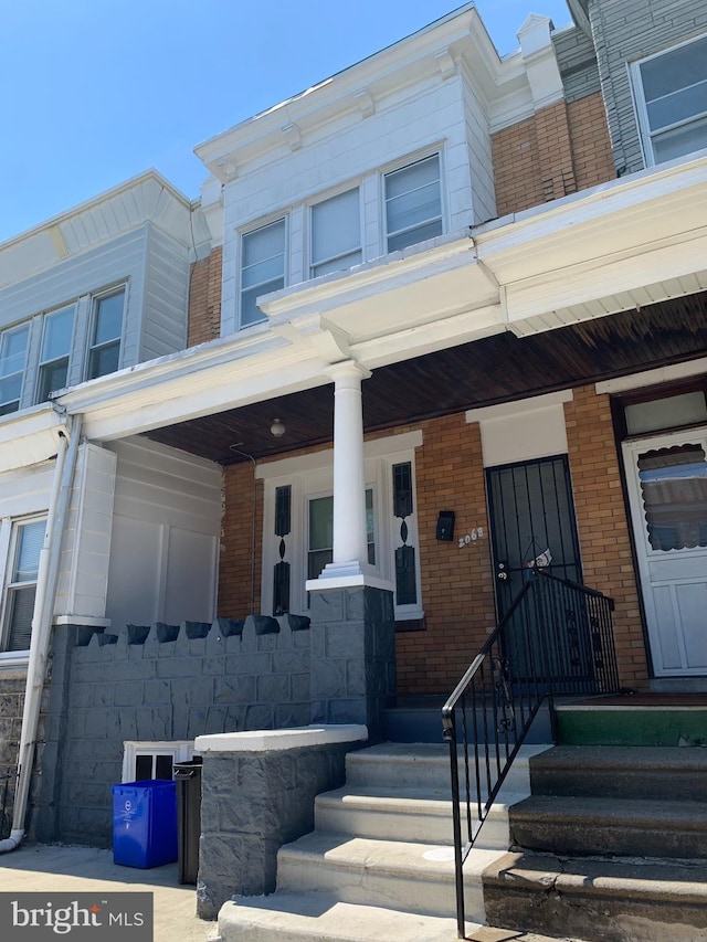 view of property with a porch