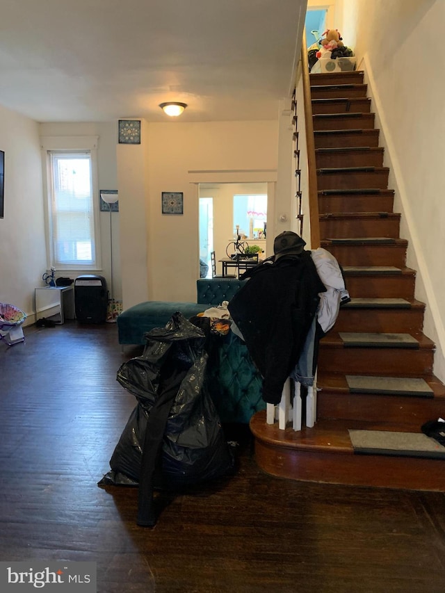 stairway featuring hardwood / wood-style flooring