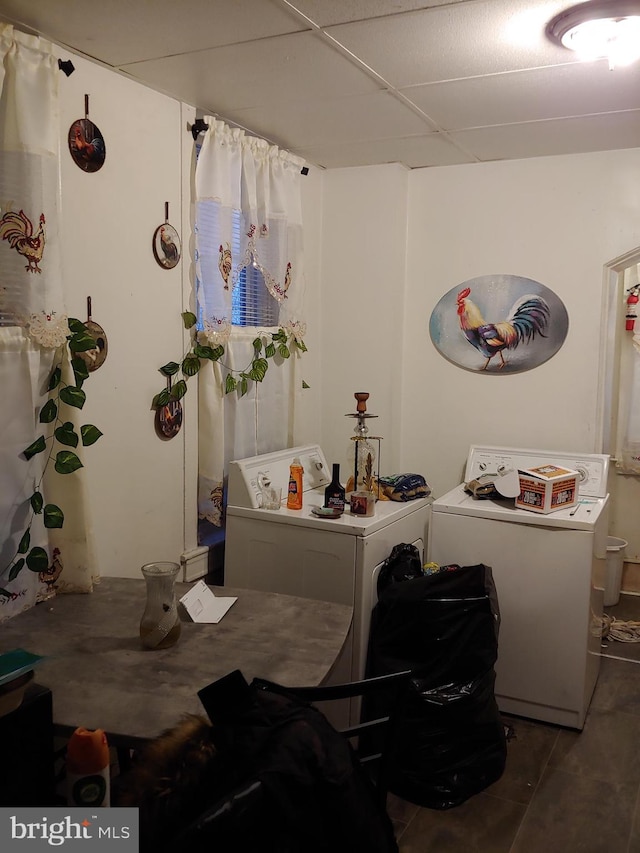 interior space featuring a paneled ceiling and independent washer and dryer