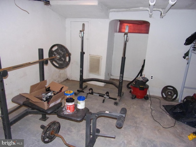 workout area featuring concrete floors