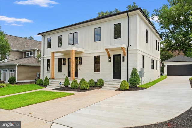 modern farmhouse with a garage and an outbuilding