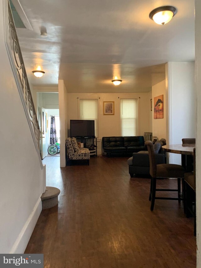 living room with dark hardwood / wood-style floors