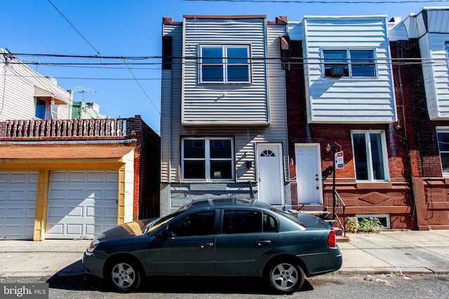 townhome / multi-family property featuring a garage