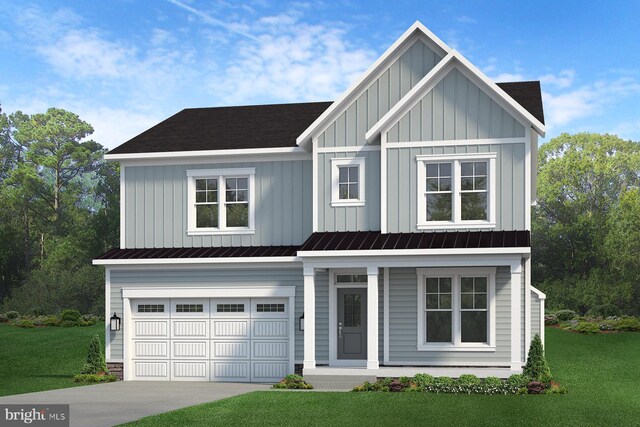 view of front of home featuring a garage and a front lawn