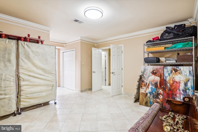 interior space with crown molding and light tile patterned floors