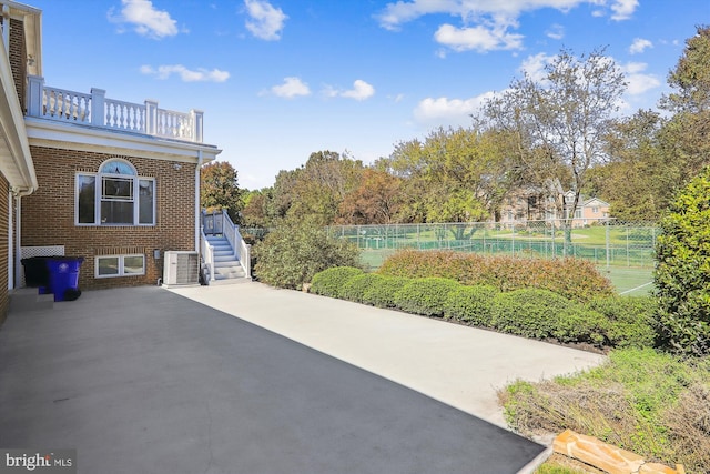 view of patio / terrace featuring a balcony and central air condition unit