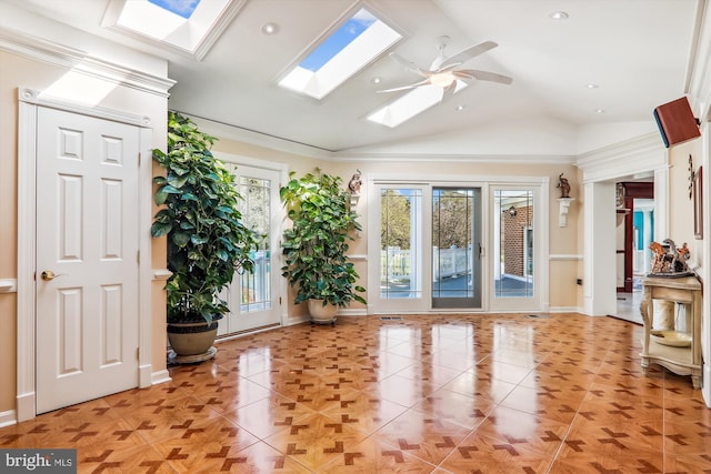 interior space with ceiling fan, ornamental molding, and vaulted ceiling