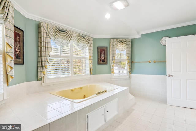 bathroom featuring a relaxing tiled tub and crown molding