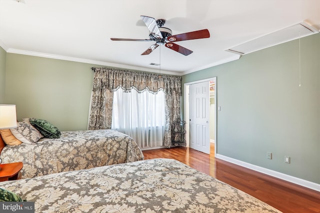 bedroom featuring ceiling fan, hardwood / wood-style flooring, and crown molding