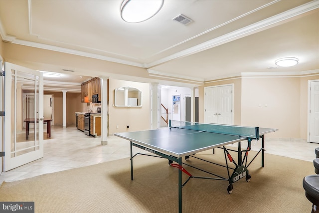 game room with ornamental molding and light tile patterned floors