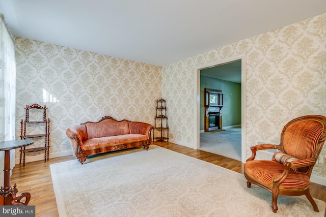 living area with hardwood / wood-style flooring