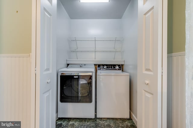 laundry area with washing machine and clothes dryer