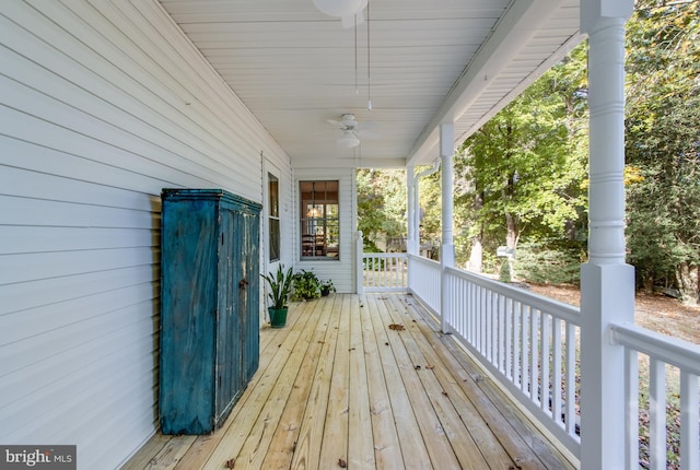 wooden terrace with ceiling fan and a porch