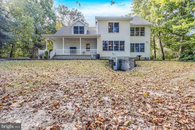 rear view of property featuring a porch