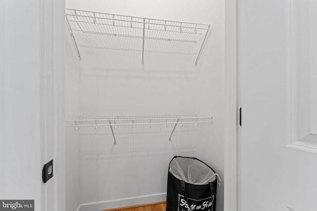 walk in closet featuring hardwood / wood-style floors