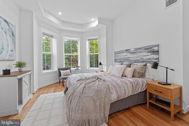 bedroom with light hardwood / wood-style floors