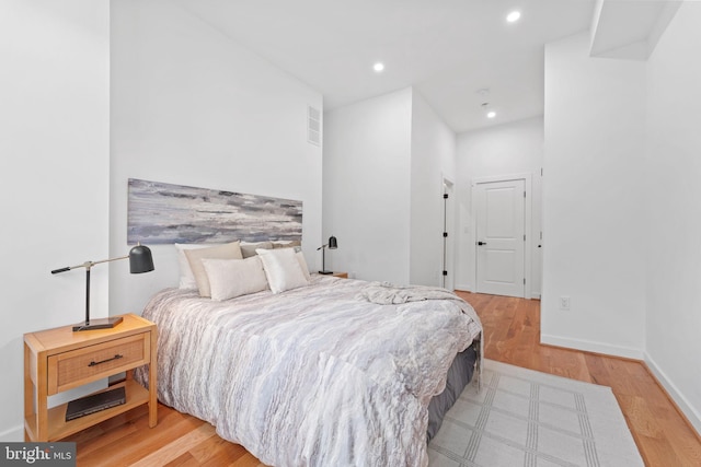 bedroom with light hardwood / wood-style flooring