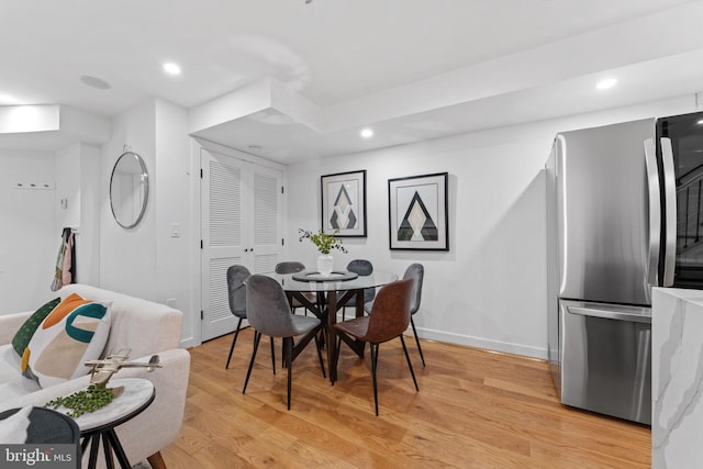 dining room featuring light hardwood / wood-style floors