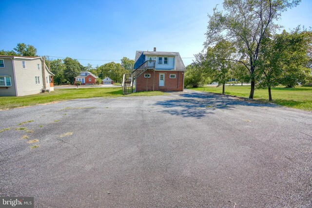 view of front facade with a garage and a front lawn