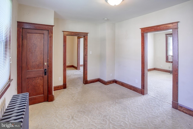 spare room featuring radiator heating unit