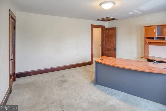 unfurnished office with light colored carpet