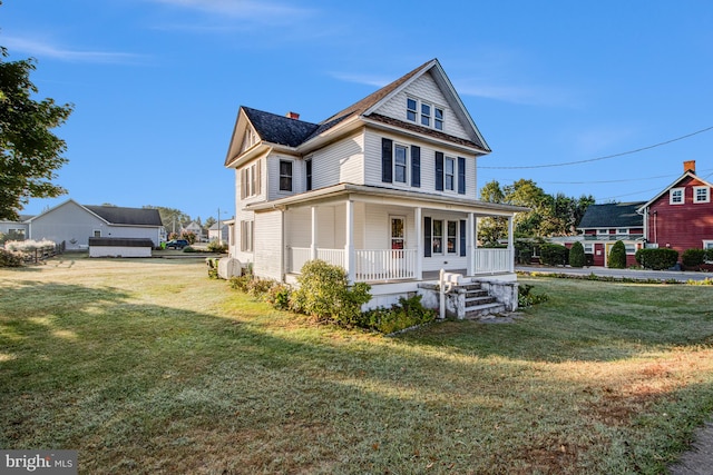 view of front of home featuring covered porch and a front lawn