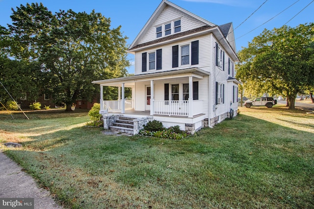 view of front of property with a porch and a front yard