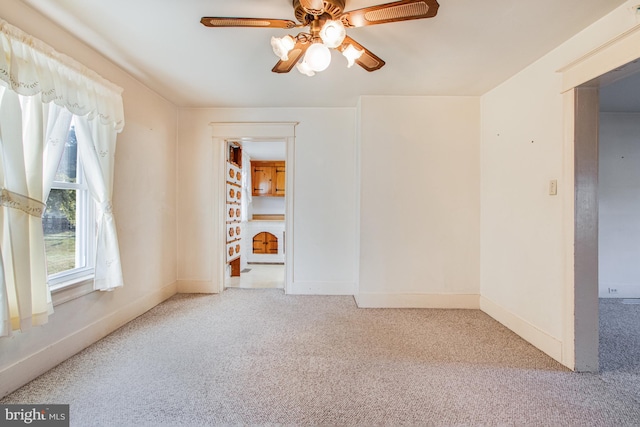 spare room with carpet flooring and ceiling fan