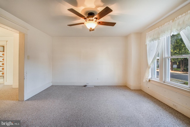 unfurnished room featuring carpet flooring and ceiling fan