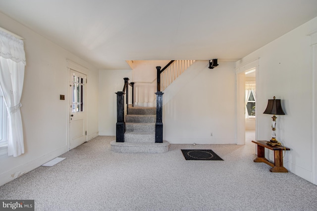 unfurnished living room with carpet