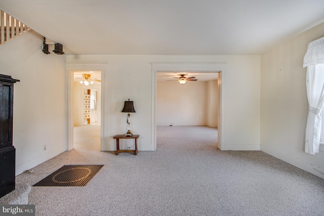 interior space featuring ceiling fan