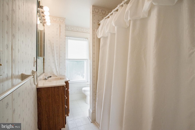 bathroom with vanity, toilet, and a shower with curtain