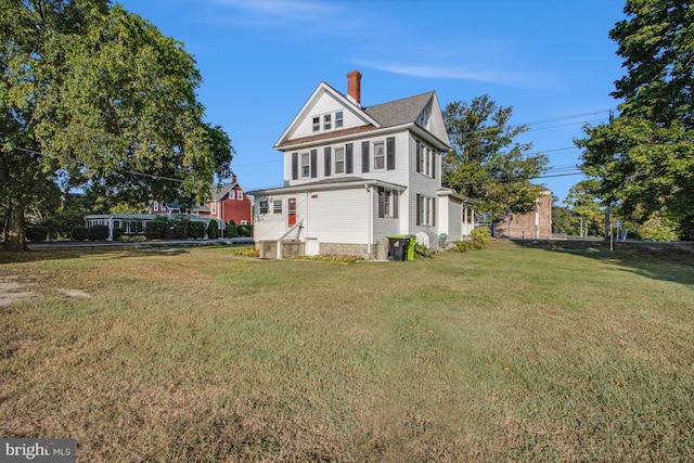 view of home's exterior featuring a yard