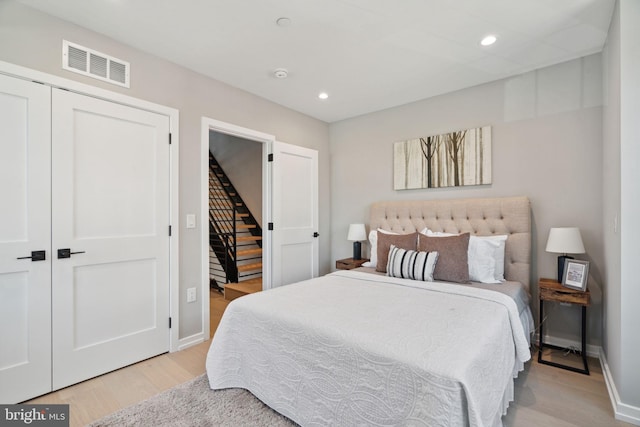 bedroom featuring a closet and light hardwood / wood-style floors